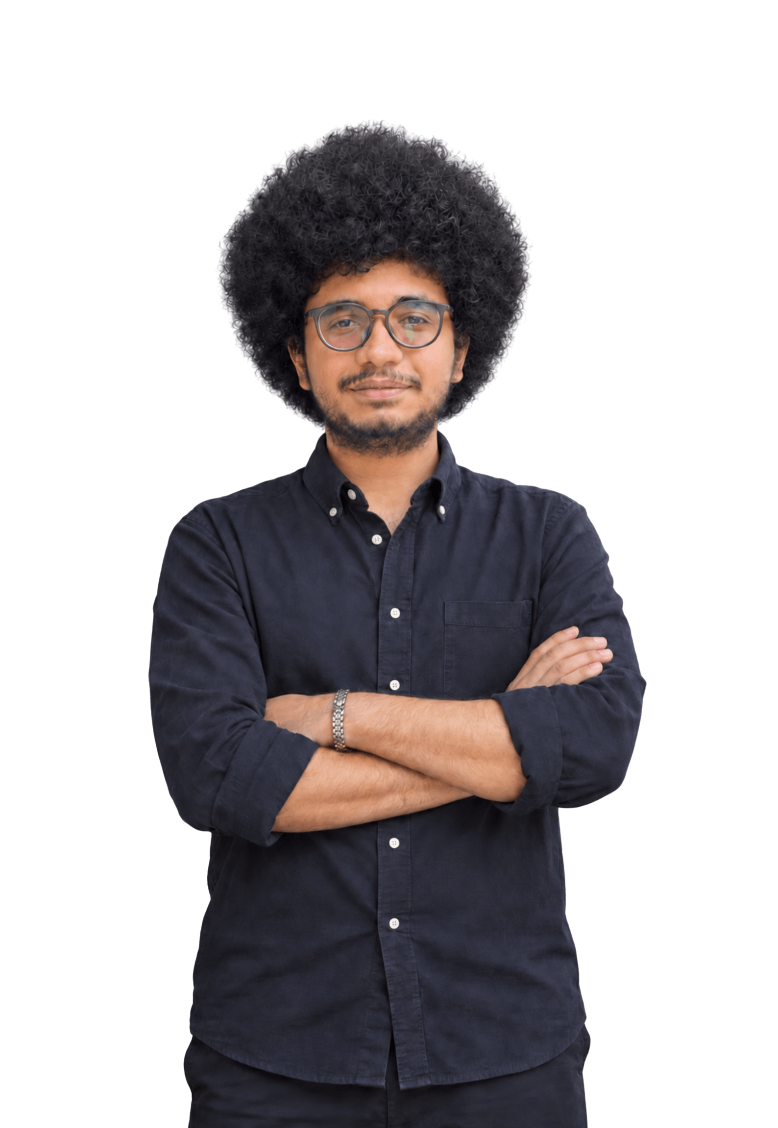 Portrait of Ilyas Lutfi Abdat wearing glasses with his arms crossed